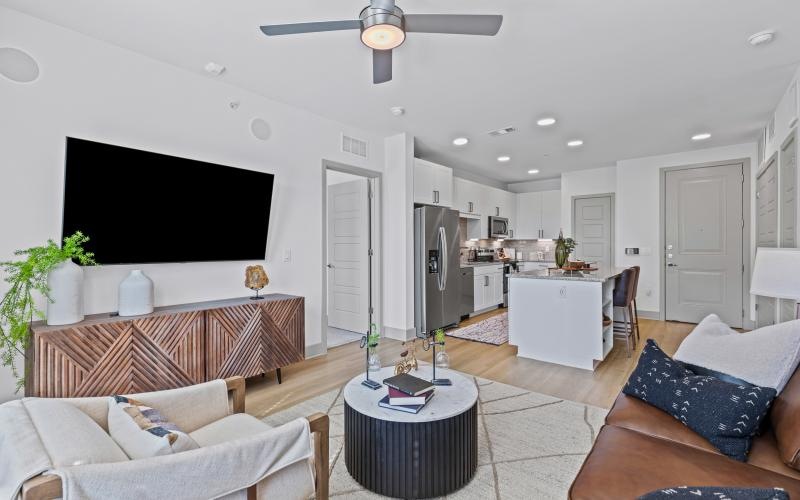 a living room with a tv and couches